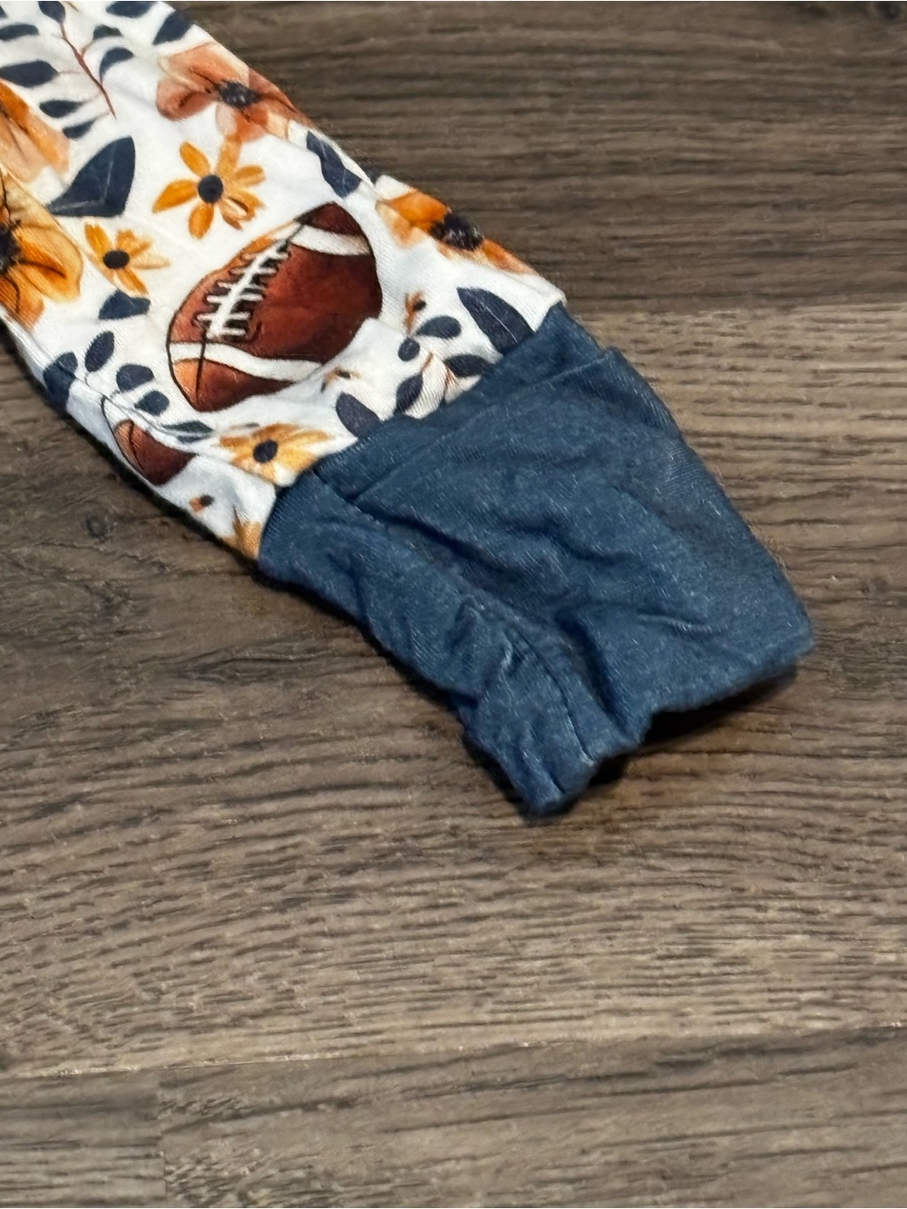 Children's Floral & Football Footed One-Piece in White and Orange with Navy Trim - Picture 4 of 4
